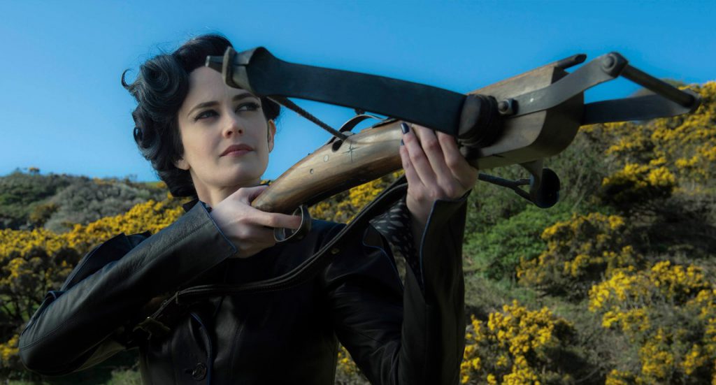 Eva Green, a thin person with pale skin and dark hair, is pointing a crossbow at something out of the frame. She is wearing stylized 40's formalwear.